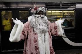 Illuminated Santa Claus Traveling  On  The Mexico City Metro