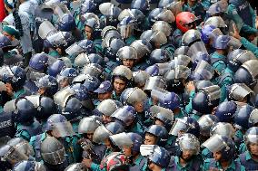 Bangladeshi police with shields and helmets stands guard - Dhaka