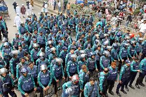 Bangladeshi police with shields and helmets stands guard - Dhaka