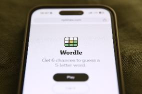 Wordle Game On Phone Photo Illustrations