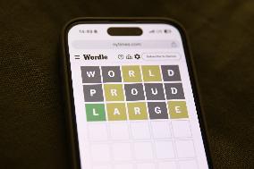 Wordle Game On Phone Photo Illustrations