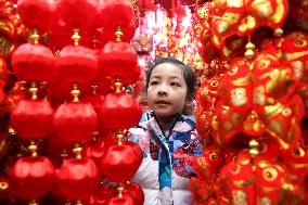 People Shop 2024 New Year Decorations in Lianyungang
