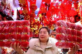People Shop 2024 New Year Decorations in Lianyungang