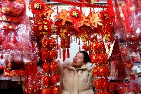 People Shop 2024 New Year Decorations in Lianyungang