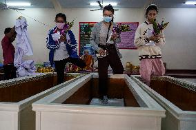 Thai People Lie In Coffins To Welcome The New Year.