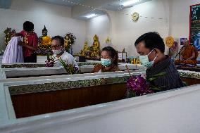 Thai People Lie In Coffins To Welcome The New Year.