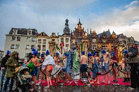 The Traditional New Year's Dive In An Original Way Held In Nijmegen.