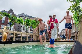The Traditional New Year's Dive In An Original Way Held In Nijmegen.