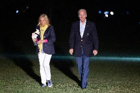 US President Joe Biden and First Lady Jill Biden return to the White House
