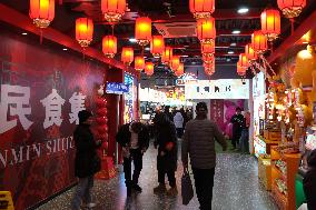 Tourists Visit The Wangfujing Commercial Street in Beijing