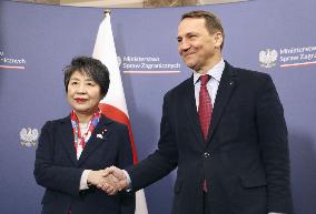 Japan foreign minister in Warsaw