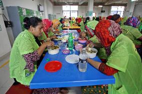 Worker Having Food In A Garments Factory - Dhaka