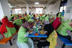 Worker Having Food In A Garments Factory - Dhaka