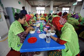 Worker Having Food In A Garments Factory - Dhaka