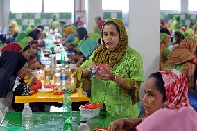 Worker Having Food In A Garments Factory - Dhaka