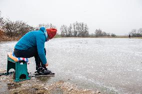 Skating On Natural Ice During Freezing Temperatures, In The Netherlands.