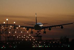 Aircraft landing at night at Barcelona airport