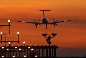 Aircraft landing at night at Barcelona airport