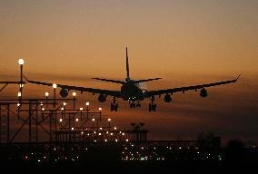 Aircraft landing at night at Barcelona airport