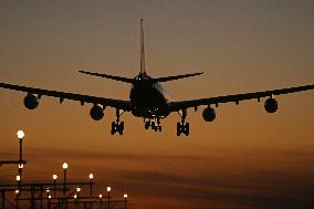 Aircraft landing at night at Barcelona airport