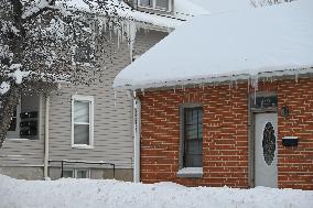 Blizzard Conditions Affect Iowa City And Icicles Form On Houses