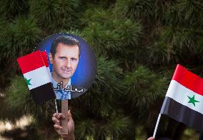 Syria's President Bashar Al-Assad Supporters