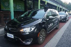 A Driverless Taxi RoboTaxi Runs on A Road in Hangzhou