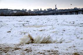 Icebound Dnipro River banks in Kyiv