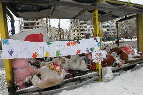 Memorial outside Dnipro apartment block ruined by Russian troops