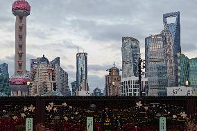 Tourists Enjoy the Bund and Nanjing Road in Shanghai