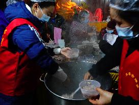 People Receive The BUDDHA PORRIDGE in Yichang