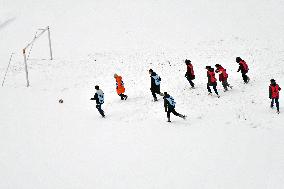 Students Play A Snow Soccer Game in Yantai