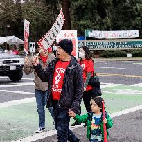 California Faculty Association (CFA) Union Members Strike On The Corners Of J Street And State University Drive At California St