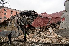 Police And Rescuers Work At The Site Of A Russian Cruise Missile That Destroyed A Sports Complex In Central Kyiv