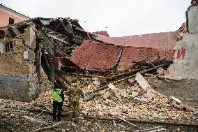 Police And Rescuers Work At The Site Of A Russian Cruise Missile That Destroyed A Sports Complex In Central Kyiv