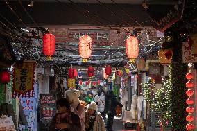 Tourists Visit the Tianzifang Commercial District in Shanghai