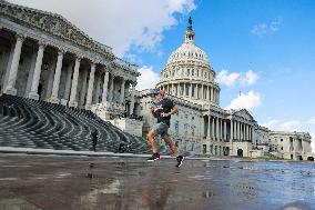 People Exercise Near U.S. Capitol During Heat Wave