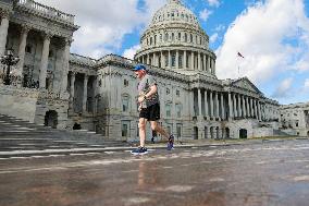 People Exercise Near U.S. Capitol During Heat Wave