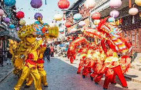 Farmers Perform A Dragon Dance For Tourists in Taizhou