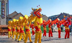 Farmers Perform A Dragon Dance For Tourists in Taizhou