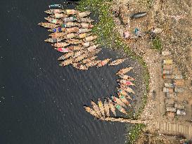 Aerial View Of Wooden Passenger Boats Docked On Buriganga River Por
