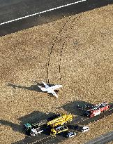 Small jet overshoots runway at Japanese airport