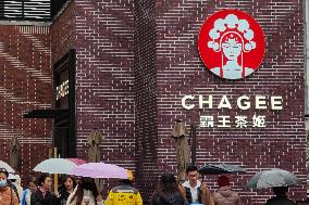 People Walk Past A CHAGEE Store in Shanghai