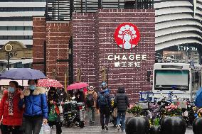 People Walk Past A CHAGEE Store in Shanghai