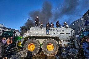Farmers Set Some Fire Ouside The EU Parliament - Brussels