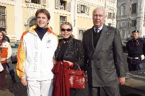 Prince Emmanuel Philibert of Savoy carries the olympic torch to the Savoia Piazza, in Turin
