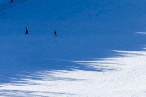 People Skiing In The Italian Alps