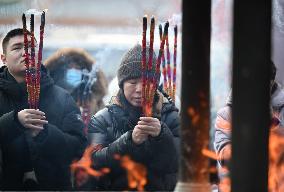 People Burn Incense Sticks at The Temple in Shenyang