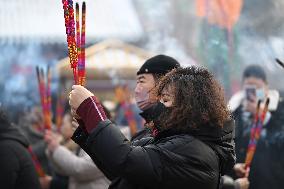 People Burn Incense Sticks at The Temple in Shenyang