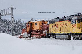 Union Pacific Train Crews Plow Tracks.